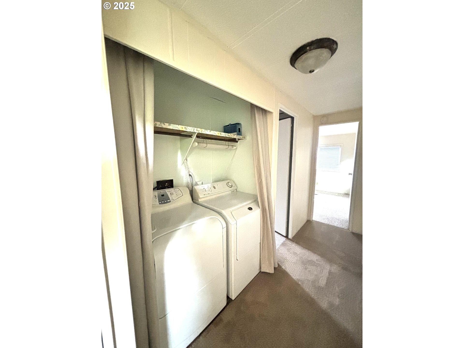 1600 Rhododendron Drive, Unit 29 Florence, OR 97439 - Photo 24 of 35 a bedroom with a bed and a mirror