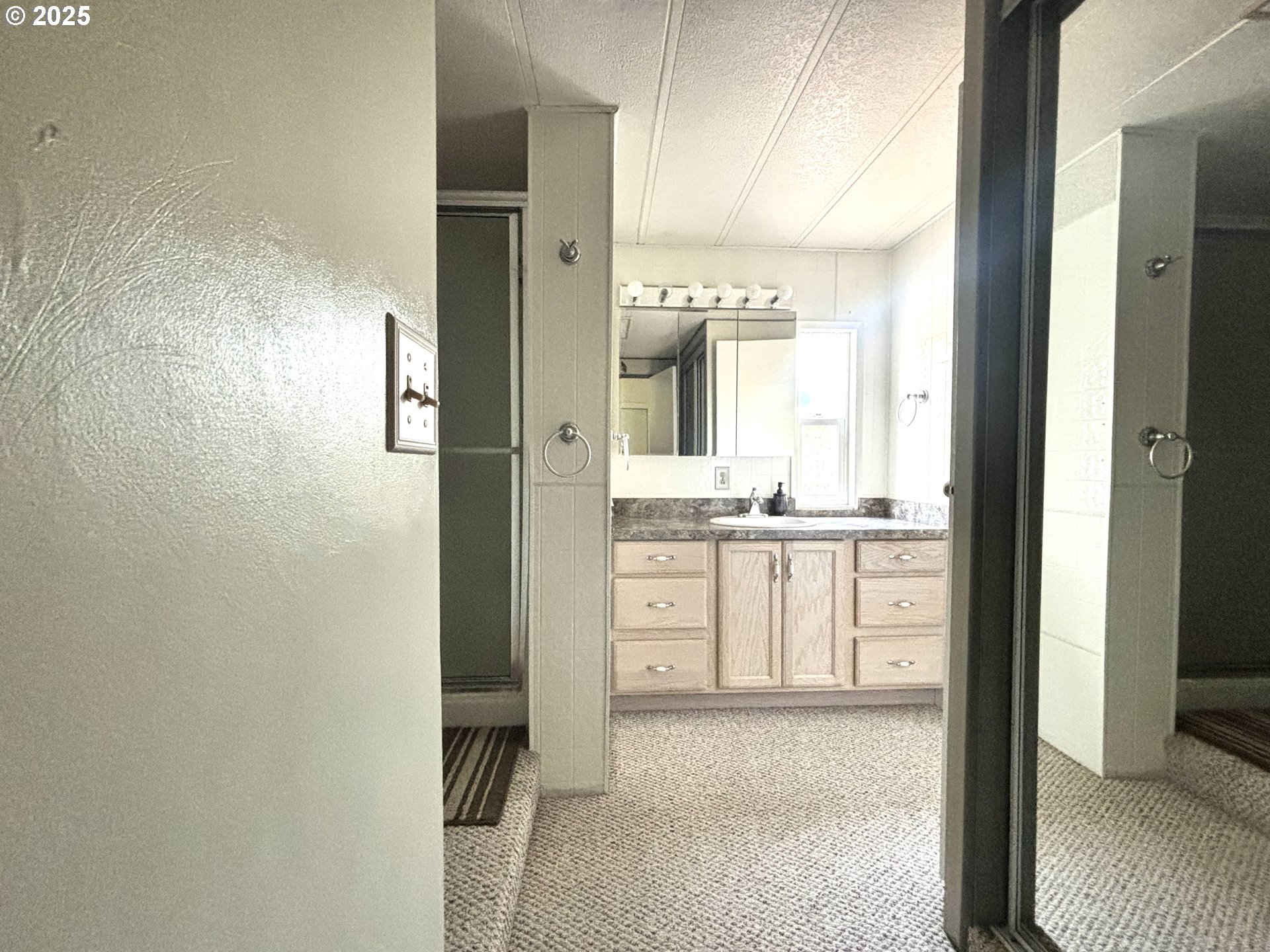 1600 Rhododendron Drive, Unit 29 Florence, OR 97439 - Photo 26 of 35 a bathroom with a granite countertop sink and a mirror