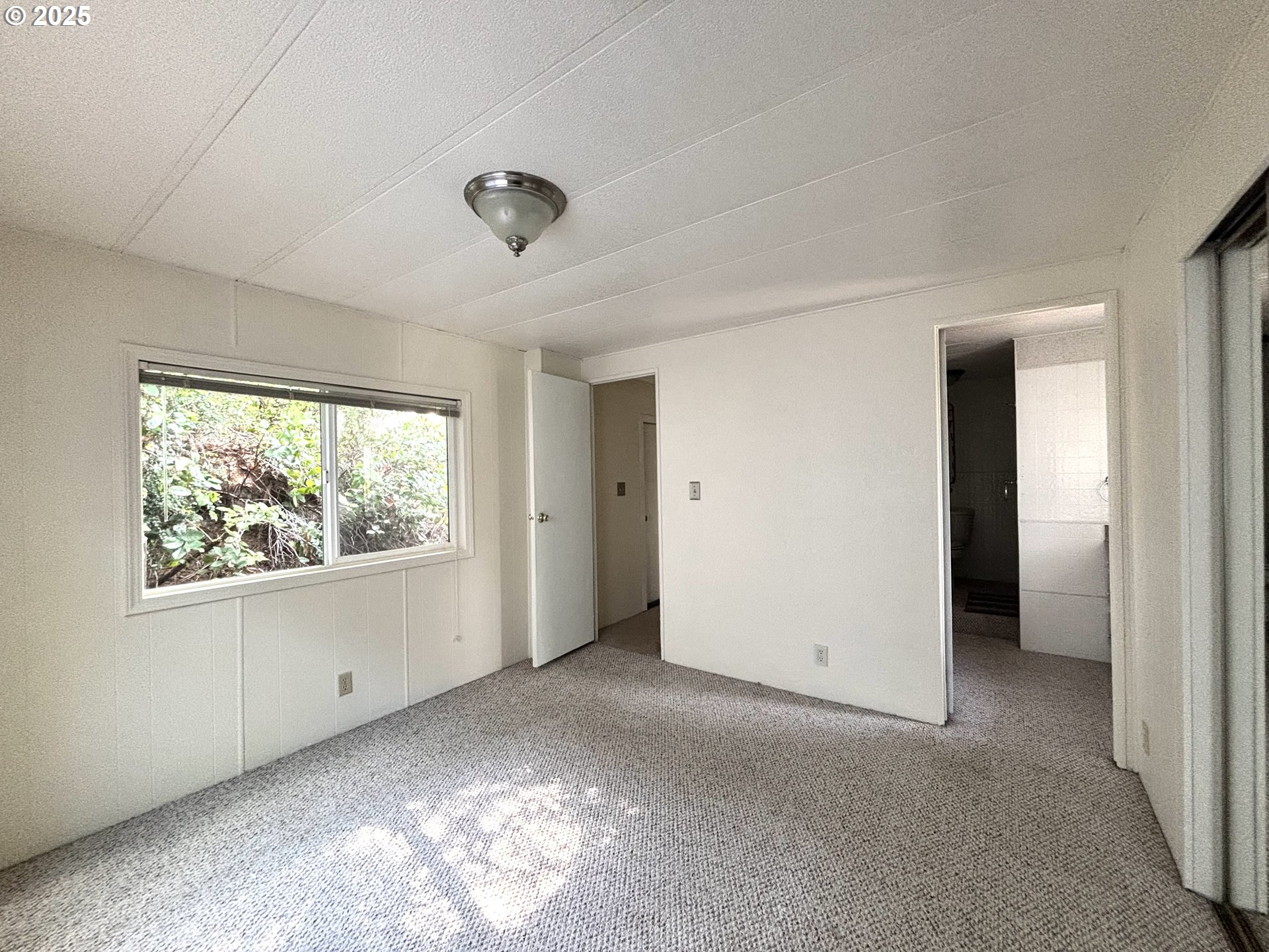 1600 Rhododendron Drive, Unit 29 Florence, OR 97439 - Photo 29 of 35 a view of a livingroom with an empty space and a window