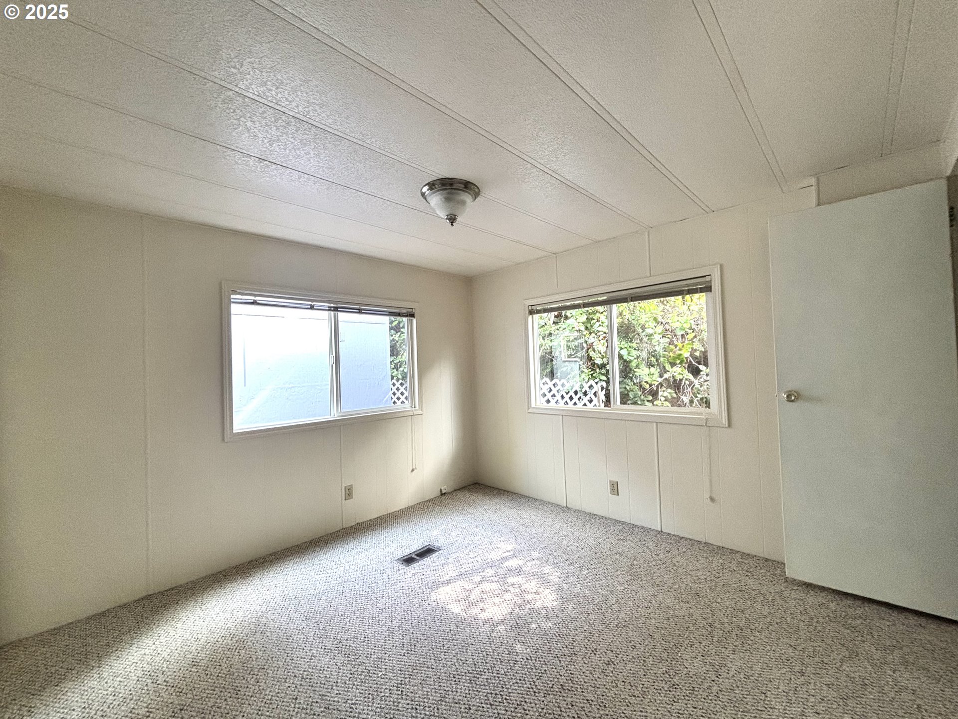 1600 Rhododendron Drive, Unit 29 Florence, OR 97439 - Photo 30 of 35 a view of an empty room with a window