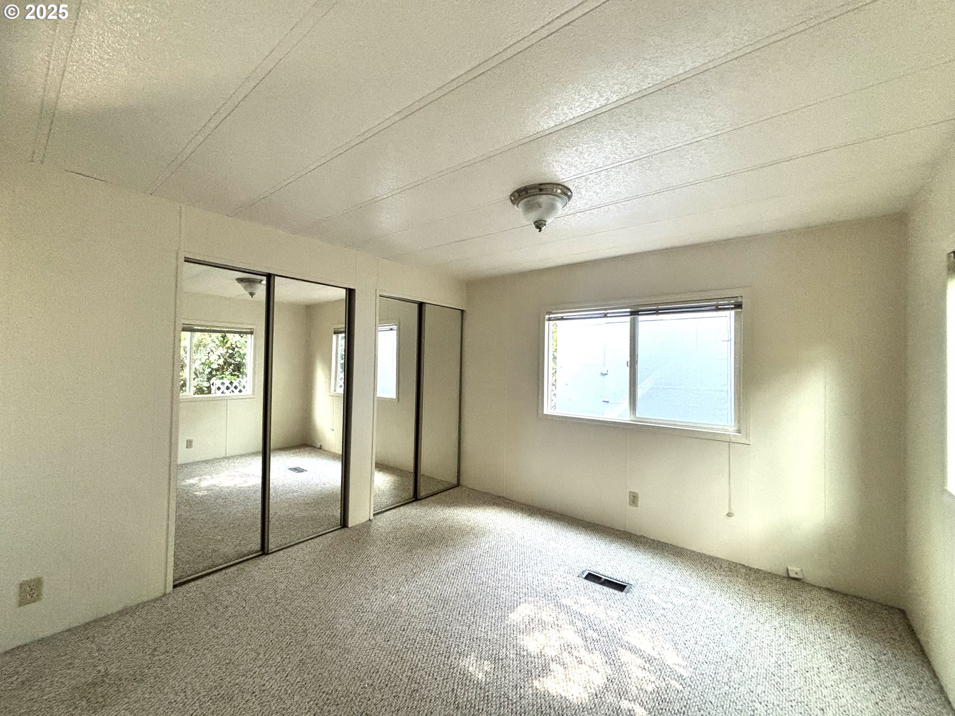 1600 Rhododendron Drive, Unit 29 Florence, OR 97439 - Photo 31 of 35 a view of an empty room with glass door