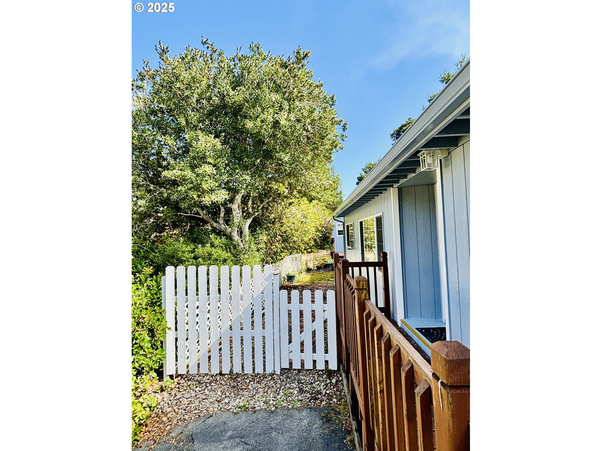 1600 Rhododendron Drive, Unit 29 Florence, OR 97439 - Photo 5 of 35 a view of a house with a small yard