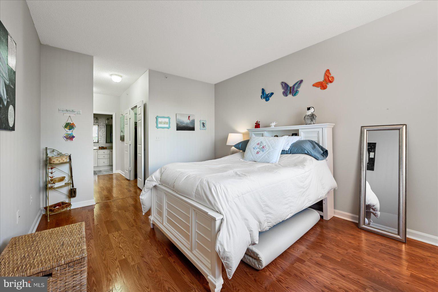 19375 Cypress Ridge Terrace, Unit 207 Leesburg, VA 20176 - Photo 16 of 44 a bed room with a bed and a couch