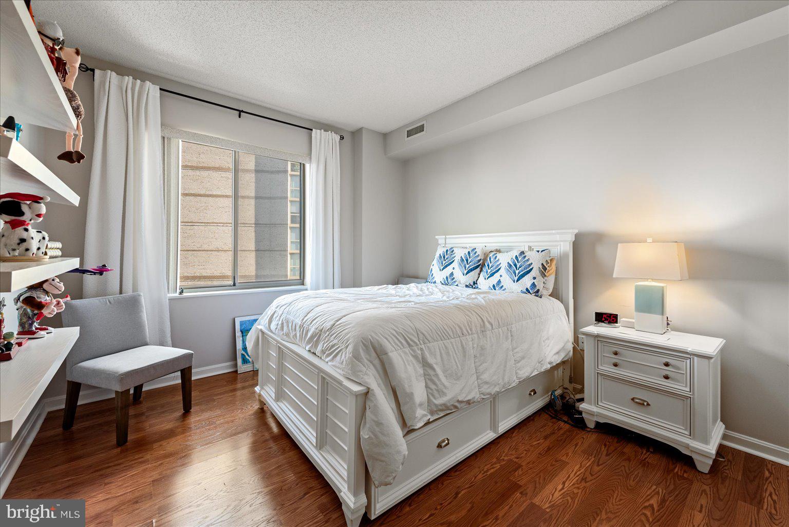 19375 Cypress Ridge Terrace, Unit 207 Leesburg, VA 20176 - Photo 20 of 44 a spacious bedroom with a bed and a window