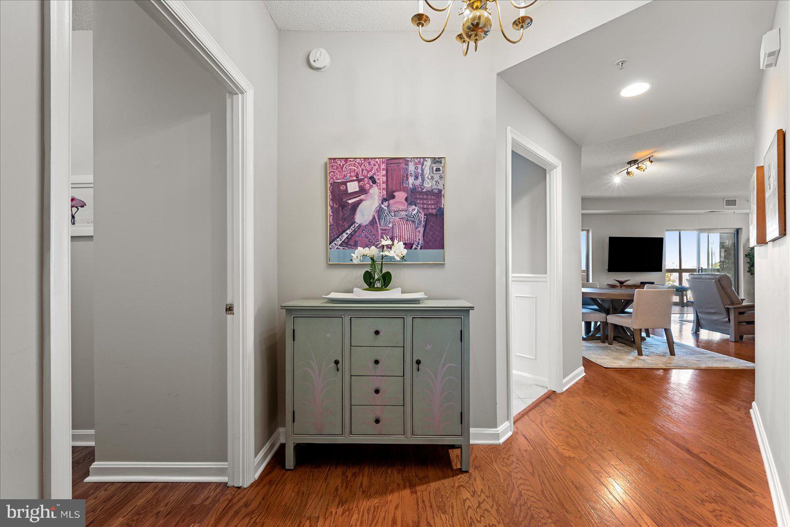 19375 Cypress Ridge Terrace, Unit 207 Leesburg, VA 20176 - Photo 2 of 44 a view of room with furniture and wooden floor
