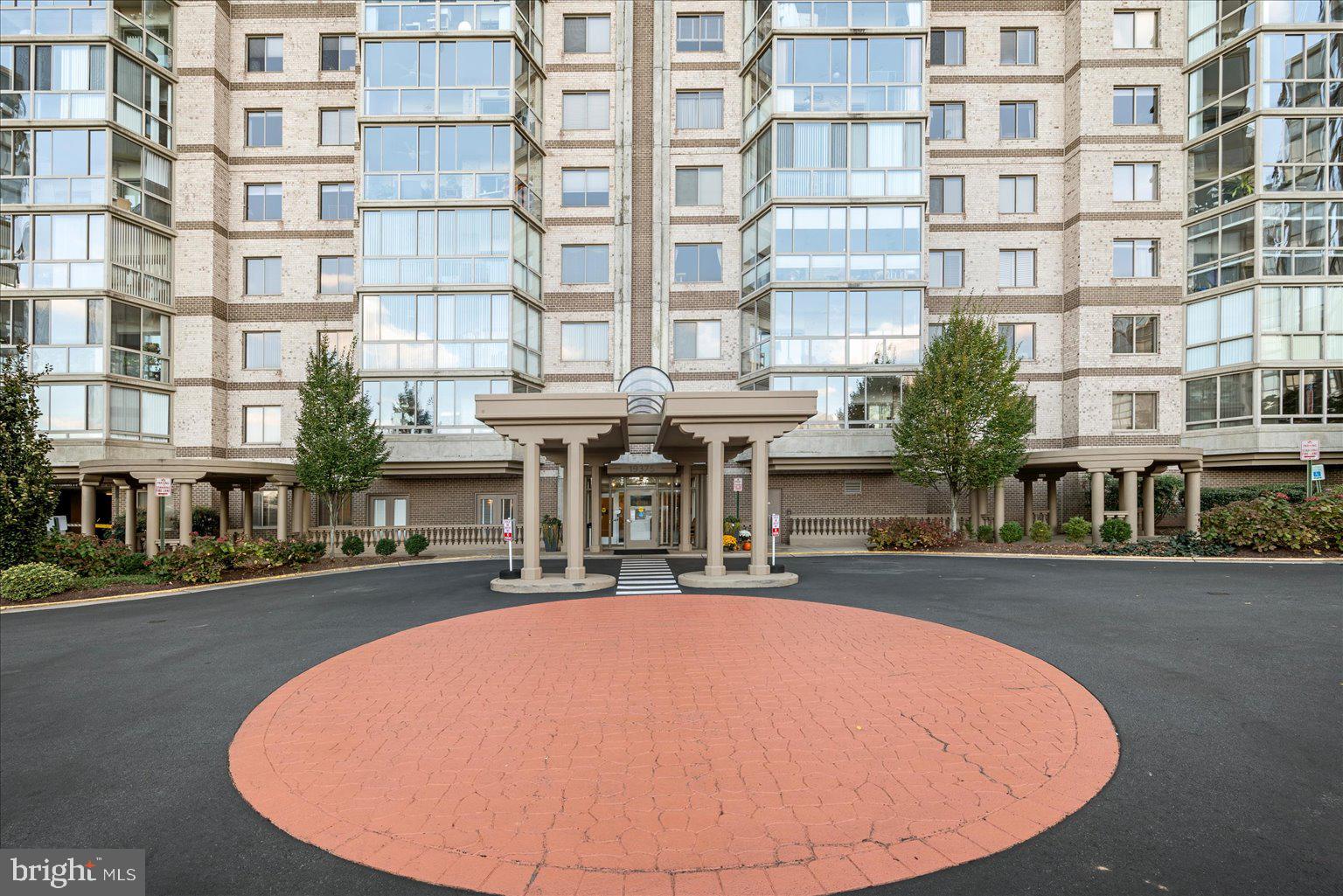 19375 Cypress Ridge Terrace, Unit 207 Leesburg, VA 20176 - Photo 26 of 44 a view of tall building with a swimming pool