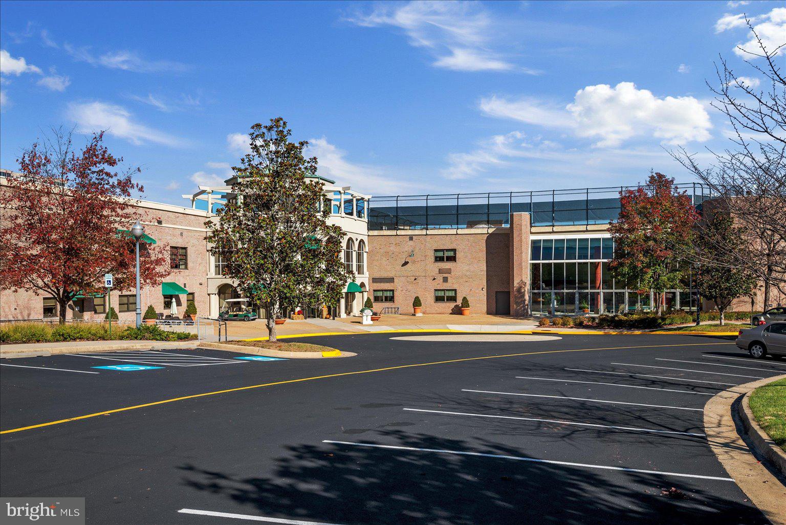 19375 Cypress Ridge Terrace, Unit 207 Leesburg, VA 20176 - Photo 41 of 44 a view of a city street lined with buildings and trees