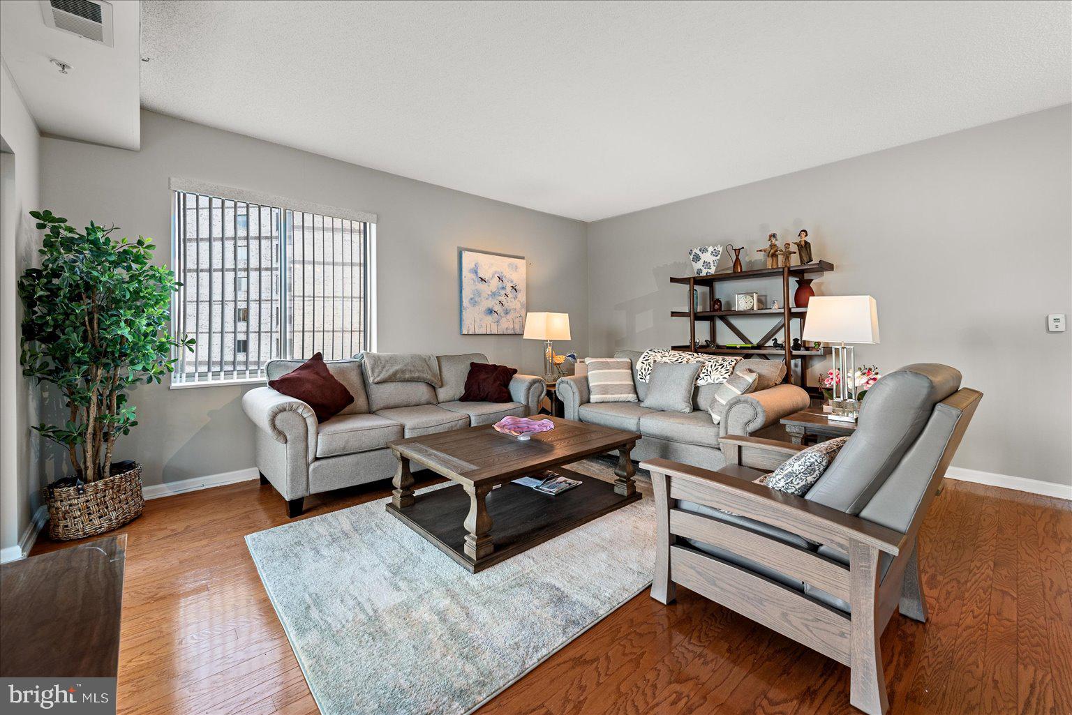 19375 Cypress Ridge Terrace, Unit 207 Leesburg, VA 20176 - Photo 5 of 44 a living room with furniture
