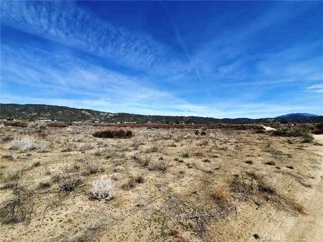 a view of a large body of water with a building in the background