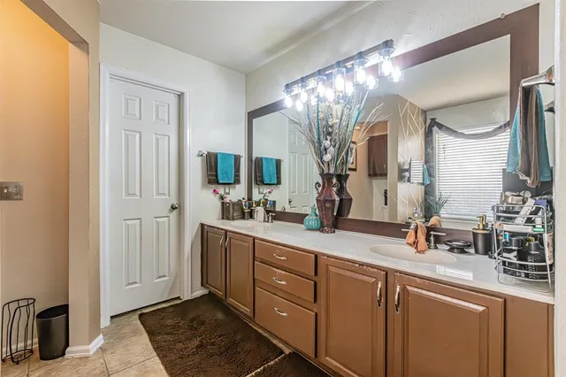 a bedroom with double bed and a window