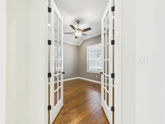 a view of an entryway with wooden floor