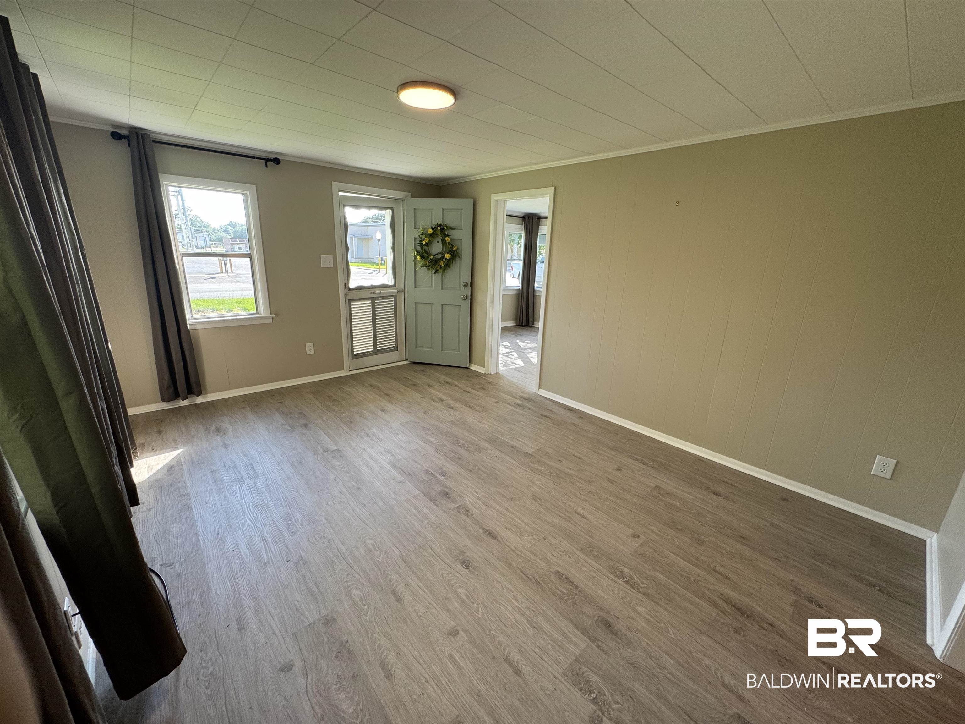 22640 Racine Street Robertsdale, AL 36567 - Photo 35 of 40 Foyer entrance featuring ornamental molding and wood finished floors