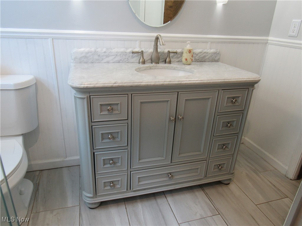1120 Vincent Road Southeast North Canton, OH 44720 - Photo 30 of 50 Main Bathroom featuring toilet and vanity