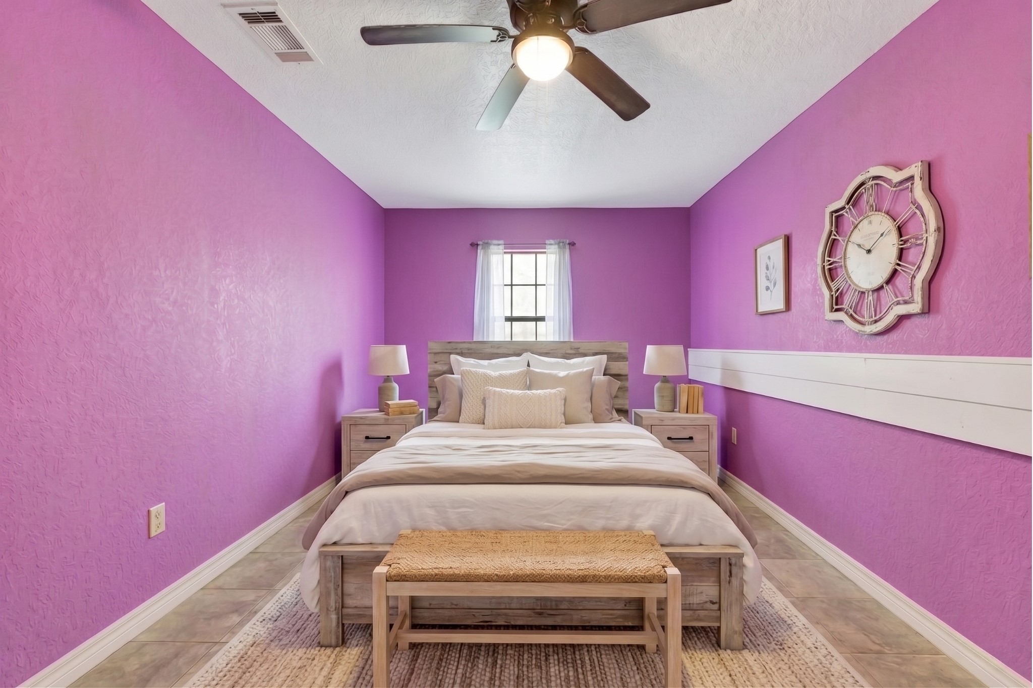 6014 Linda Drive Rosharon, TX 77583 - Photo 17 of 22 Bedroom 3 features neutral tile flooring, a central window for natural light, and a ceiling fan with integrated lighting for added comfort and brightness.**Virtually staged