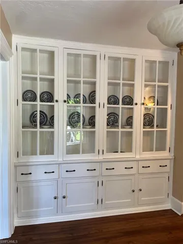 a view of wooden floor and windows in a room