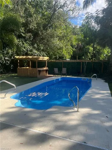 a view of a swimming pool with a patio