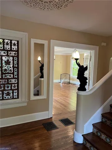 a view of a living room with wooden floor