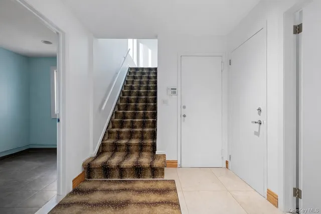 a view of entryway with wooden floor