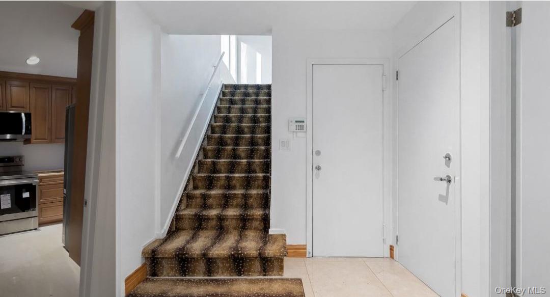 90 Rodeo Drive Syosset, NY 11791 - Photo 7 of 18 a view of a hallway with windows and bathroom