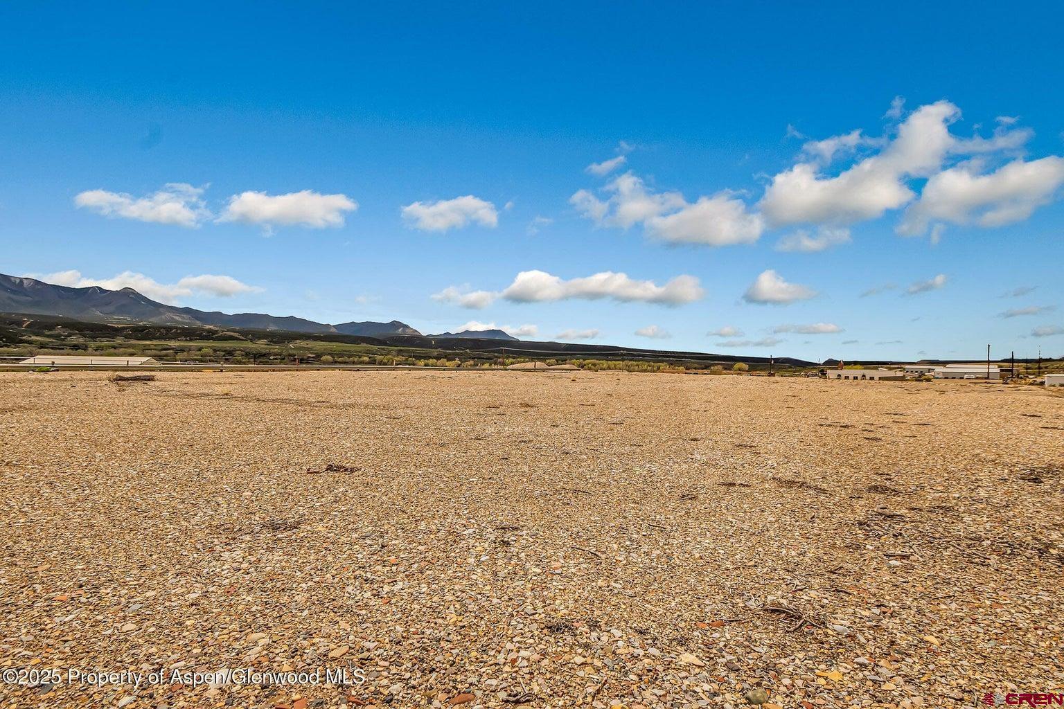 409 Mosher Avenue Parachute, CO 81635 - Photo 9 of 28 a view of a lake and sunset