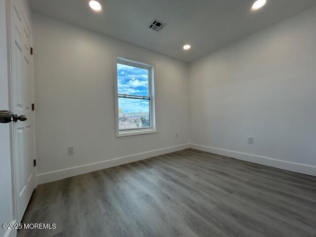 43 Salem Place Cliffwood, NJ 07721 - Photo 9 of 17 an empty room with wooden floor and windows