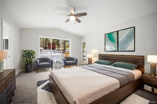 a bedroom with double bed and a window