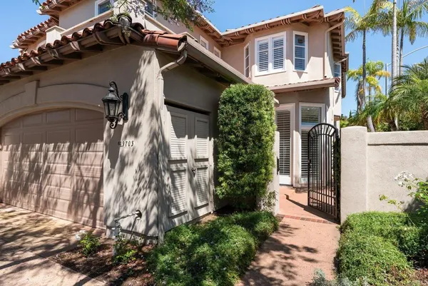 a view of a house with a potted plant and windows