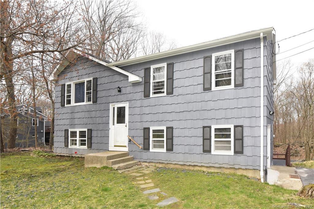 62 Scott Ridge Road Ridgefield, CT 06877 - Photo 1 of 1 a house that has a big yard in front of it