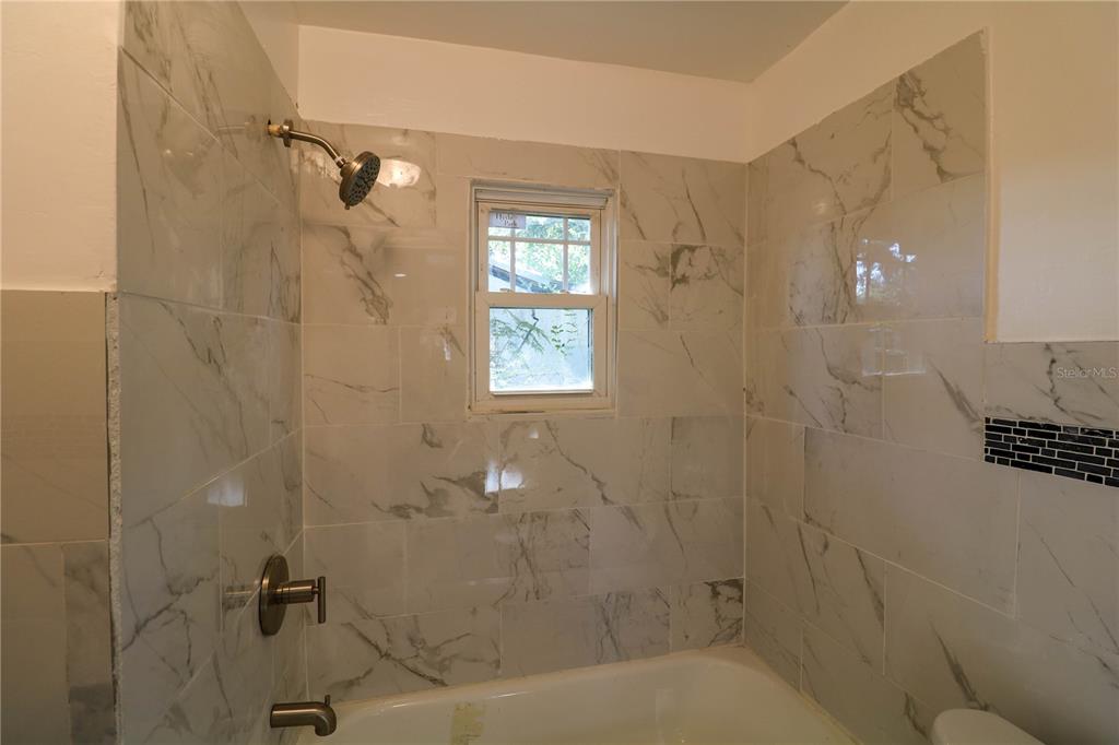 1518 Indiana Street Orlando, FL 32805 - Photo 13 of 17 a bathroom with a shower