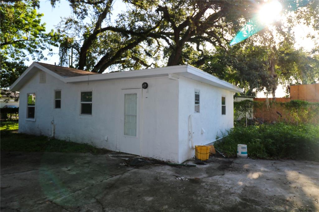 1518 Indiana Street Orlando, FL 32805 - Photo 3 of 17 a view of a yard with a house and a tree