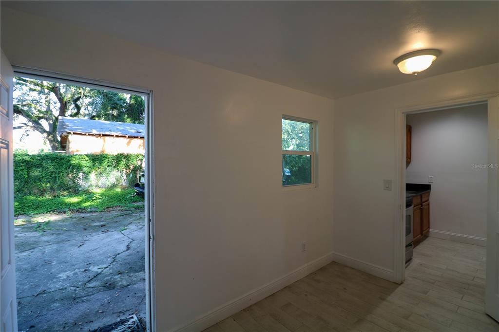 1518 Indiana Street Orlando, FL 32805 - Photo 6 of 17 an empty room with windows