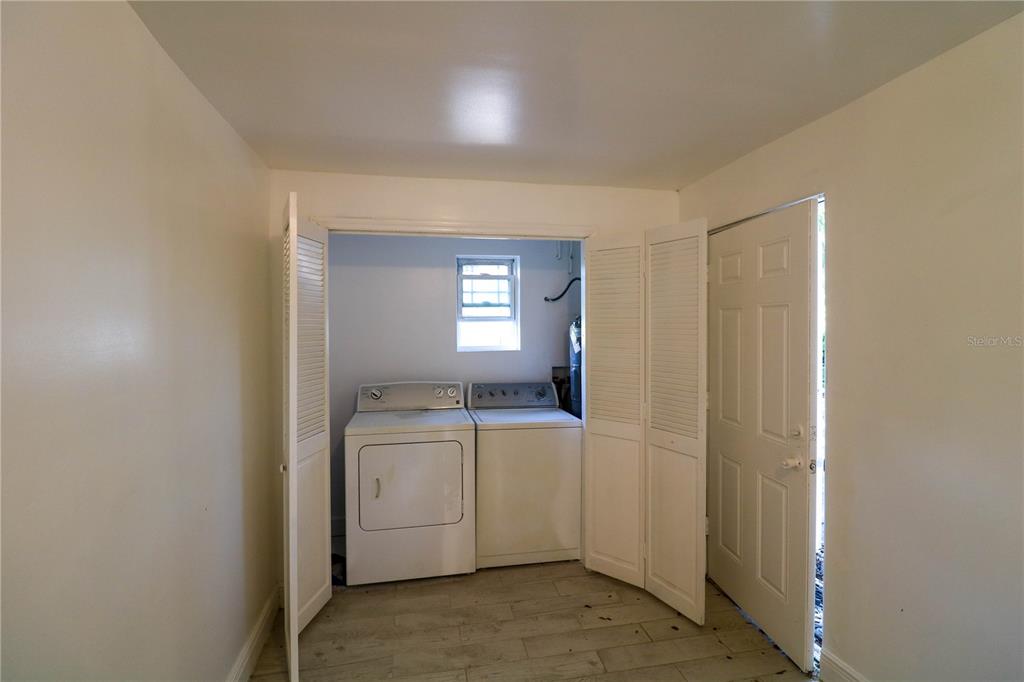 1518 Indiana Street Orlando, FL 32805 - Photo 7 of 17 a room with a sink dryer and washer