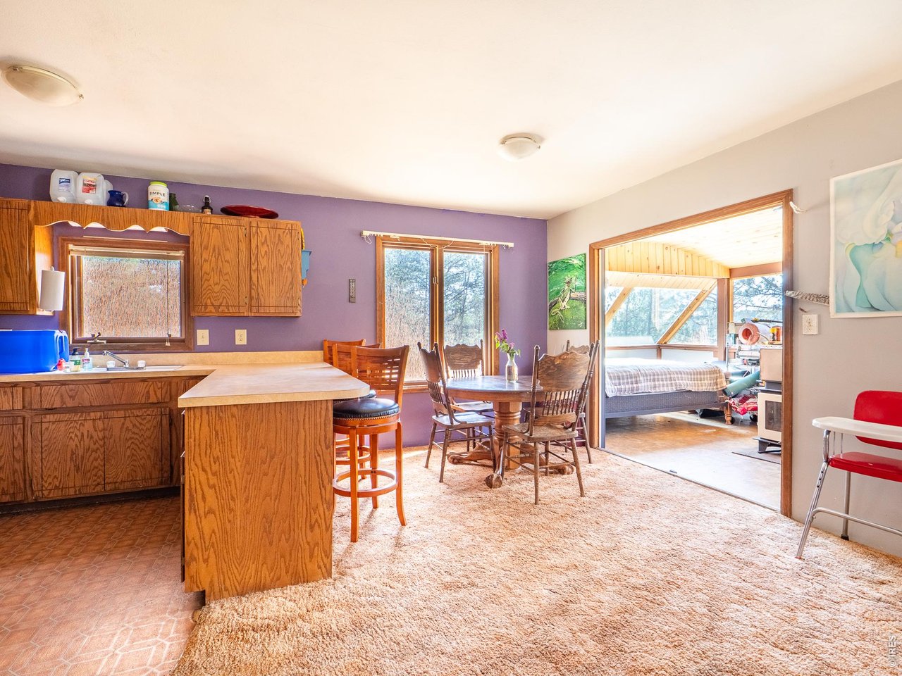 263 Badger Court Drake, CO 80515 - Photo 13 of 41 a large kitchen with a large counter top furniture a sink a stove and a window