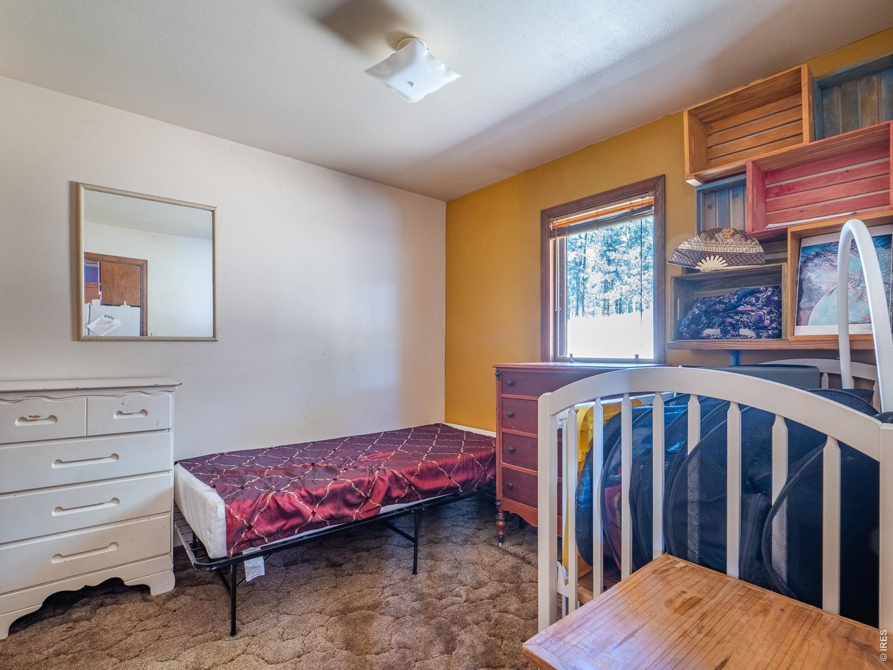 263 Badger Court Drake, CO 80515 - Photo 21 of 41 a bedroom with a bed and a window