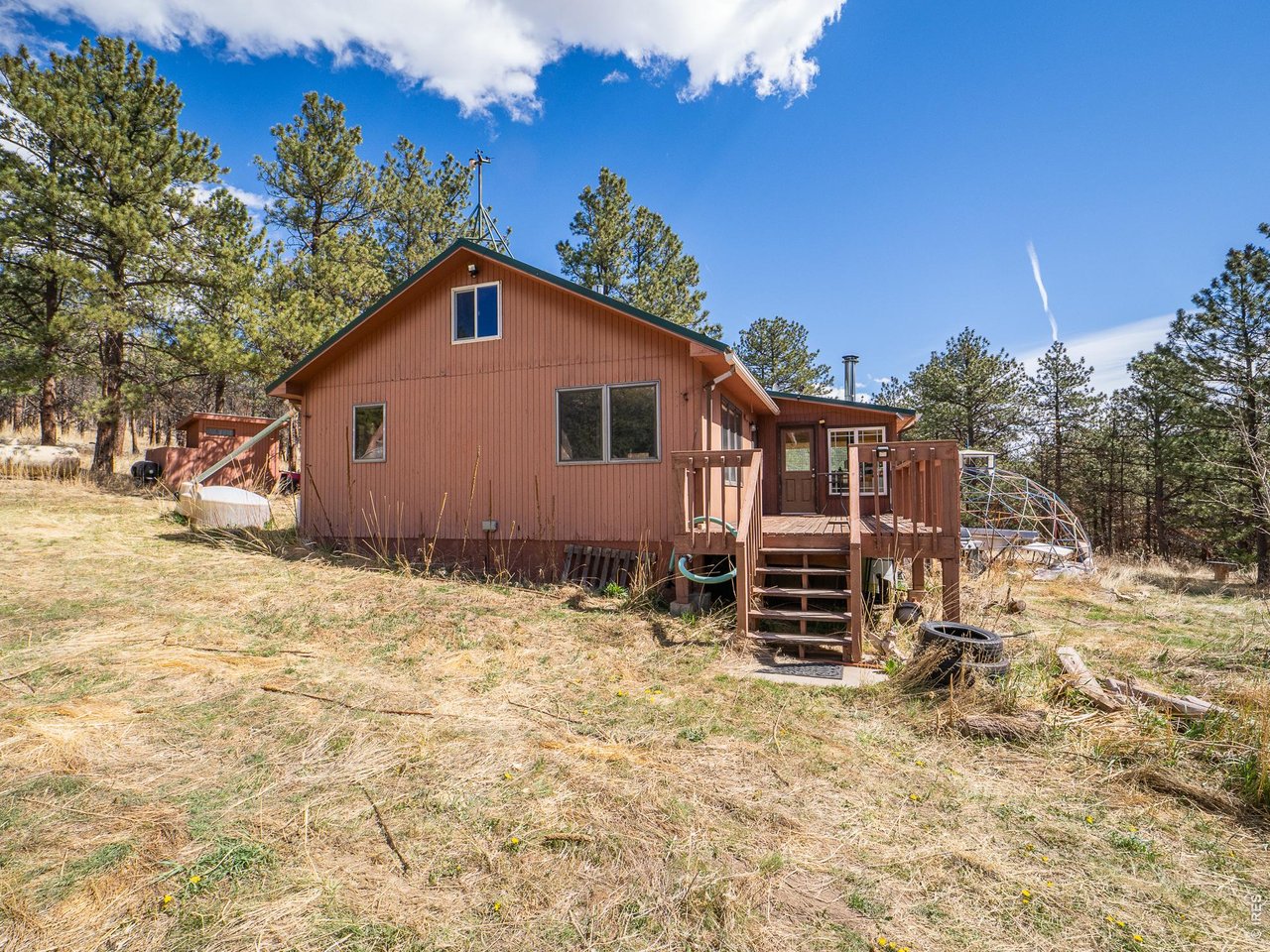 263 Badger Court Drake, CO 80515 - Photo 24 of 41 a view of a house with a yard