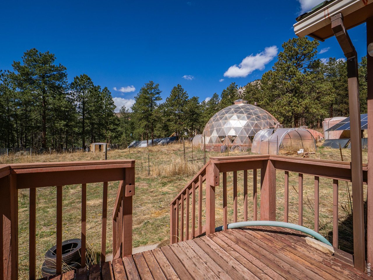 263 Badger Court Drake, CO 80515 - Photo 25 of 41 a balcony with wooden floor and outdoor seating