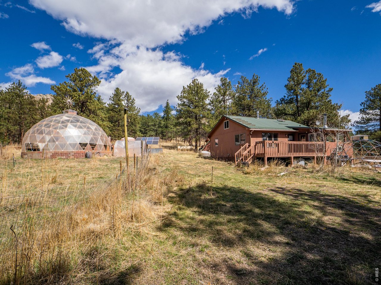 263 Badger Court Drake, CO 80515 - Photo 26 of 41 a view of a house with a yard