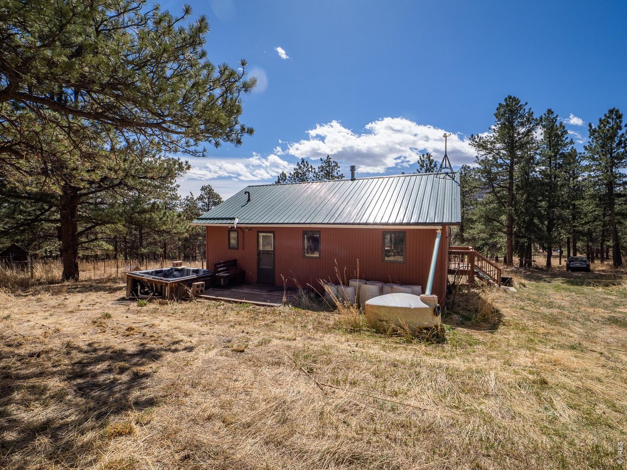 263 Badger Court Drake, CO 80515 - Photo 27 of 41 a view of a house with a yard and sitting area