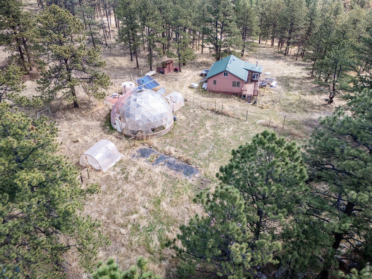 263 Badger Court Drake, CO 80515 - Photo 29 of 41 a backyard of a house with a table and chairs