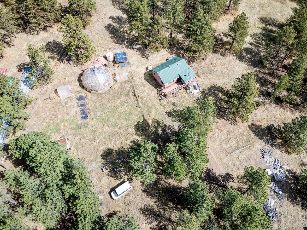 263 Badger Court Drake, CO 80515 - Photo 30 of 41 an aerial view of a house with a yard and swimming pool