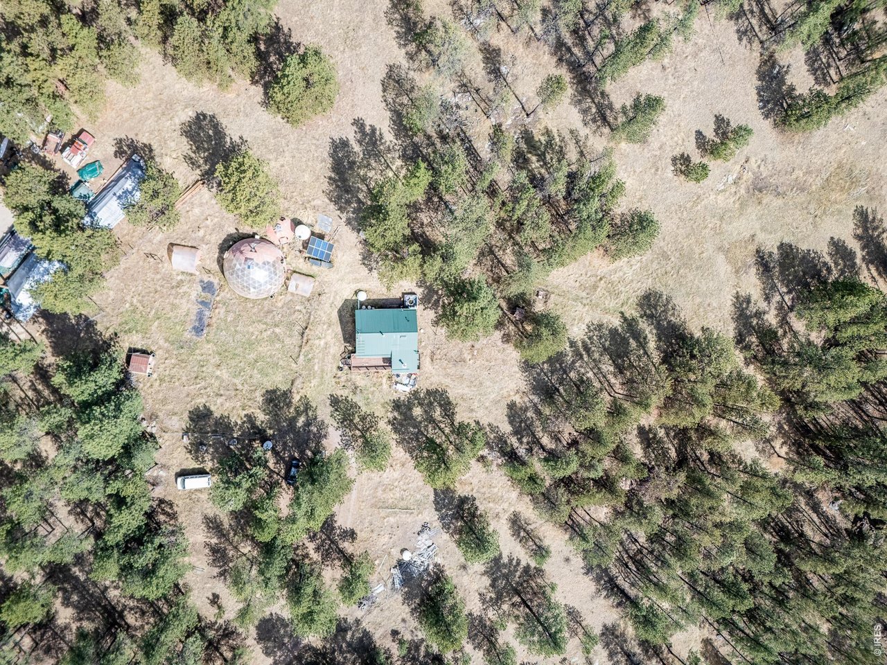 263 Badger Court Drake, CO 80515 - Photo 32 of 41 a aerial view of residential house with space and trees all around