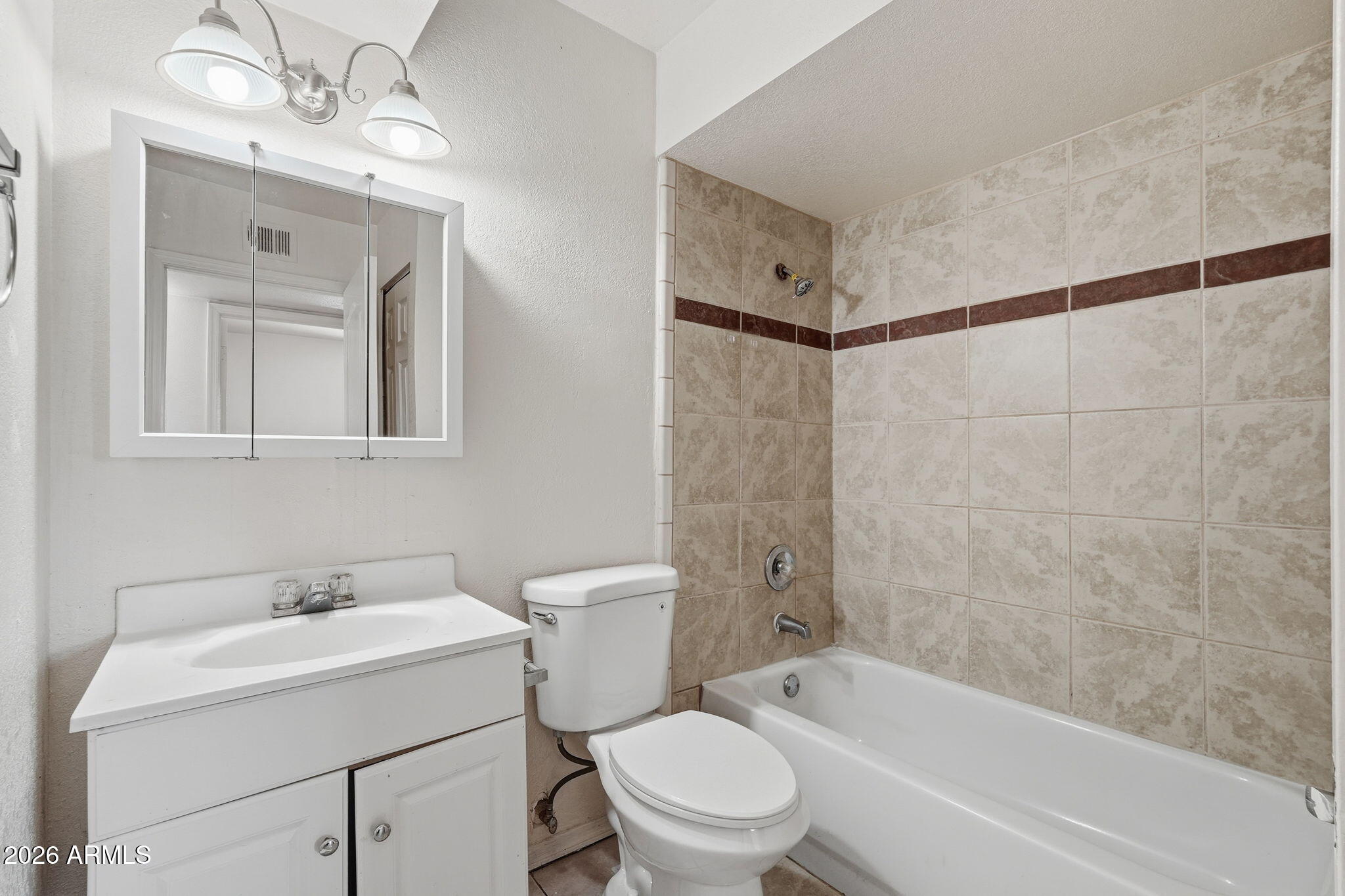 6452 West Thomas Road Phoenix, AZ 85033 - Photo 24 of 30 a bathroom with a sink toilet and shower