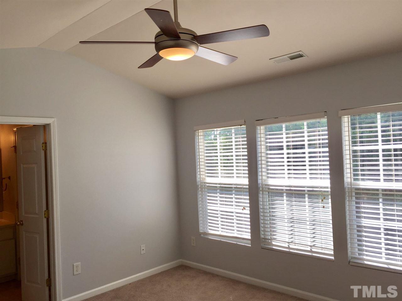 8511 Mt Valley Lane Raleigh, NC 27613 - Photo 13 of 25 a view of a livingroom with a ceiling fan and window