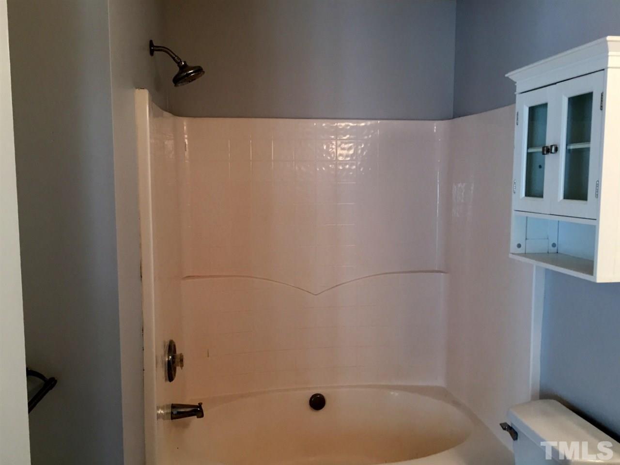 8511 Mt Valley Lane Raleigh, NC 27613 - Photo 17 of 25 a bathroom with a shower