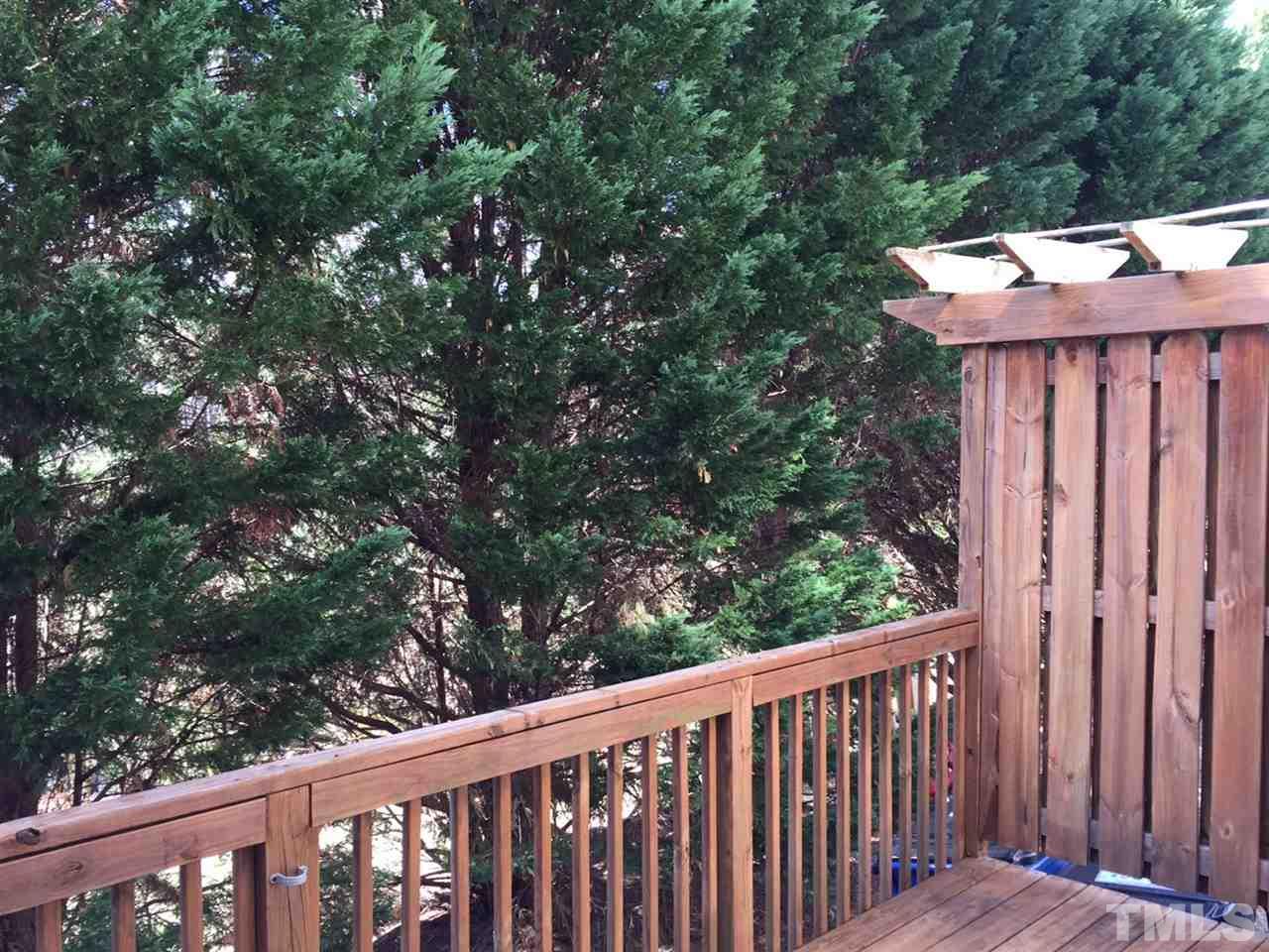 8511 Mt Valley Lane Raleigh, NC 27613 - Photo 20 of 25 a view of a wooden bench in a balcony