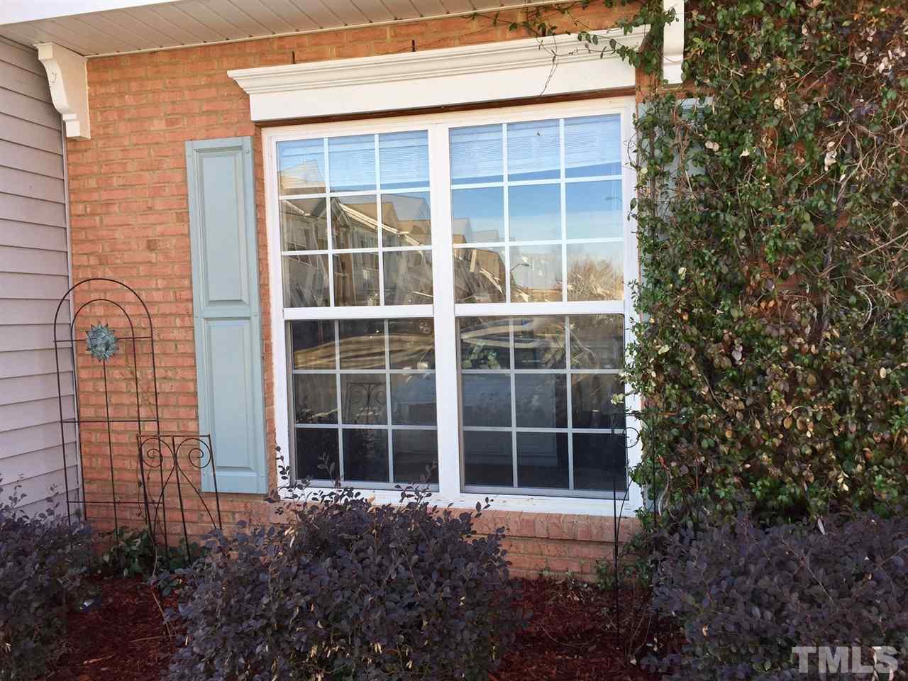 8511 Mt Valley Lane Raleigh, NC 27613 - Photo 3 of 25 a view of a door with a window