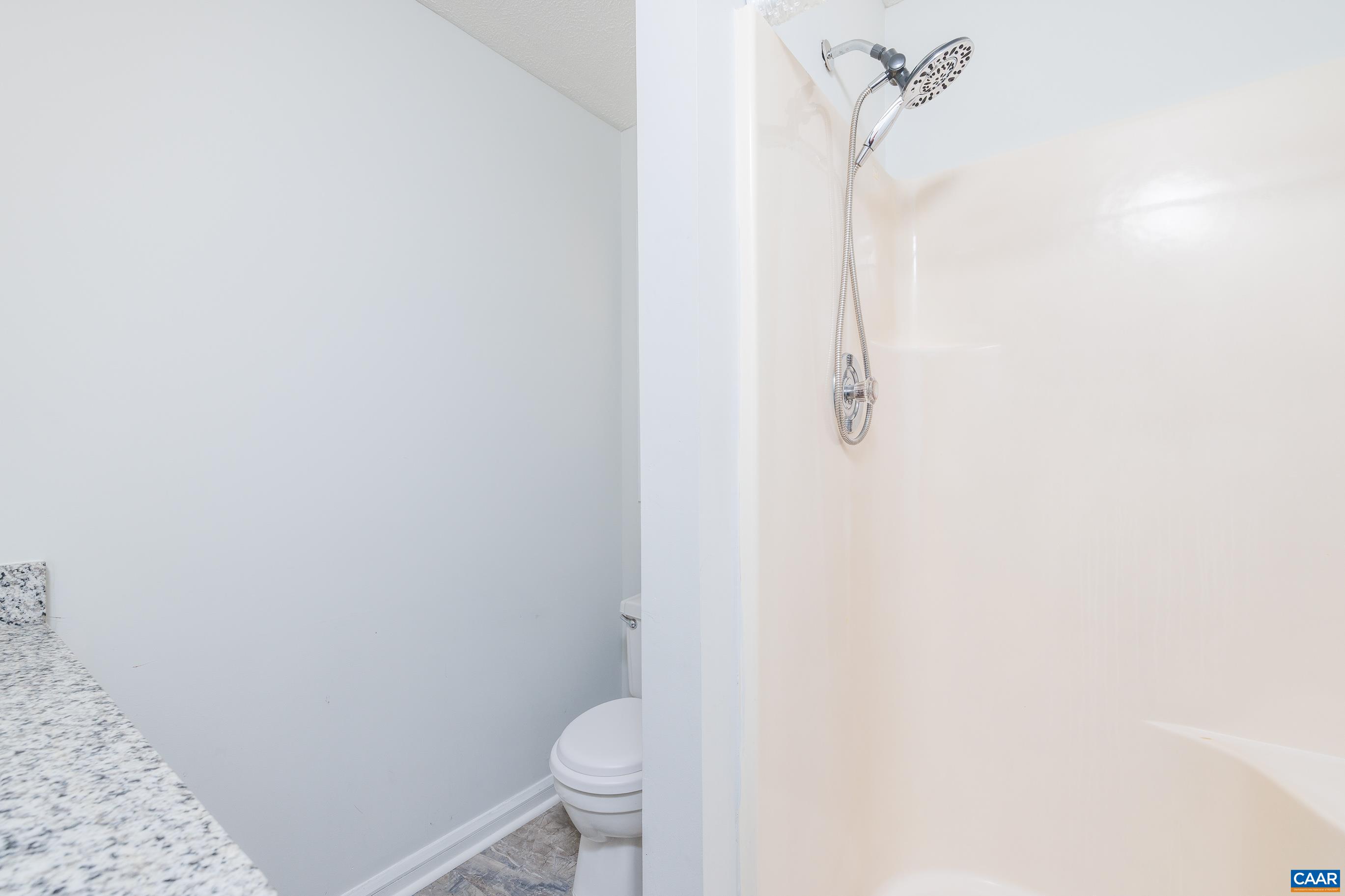 20 Loblolly Road Palmyra, VA 22963 - Photo 31 of 31 a bathroom with a granite countertop toilet and a shower