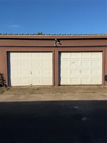 a view of a livingroom with wooden floor and a window