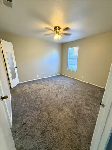 a view of a livingroom with a ceiling fan
