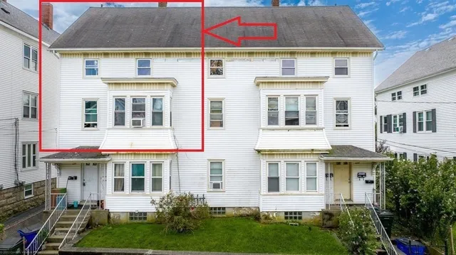 a view of a building with a yard